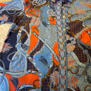 Multi colored Gretchen Scott shirt. Good condition. Comfortable. No stains.